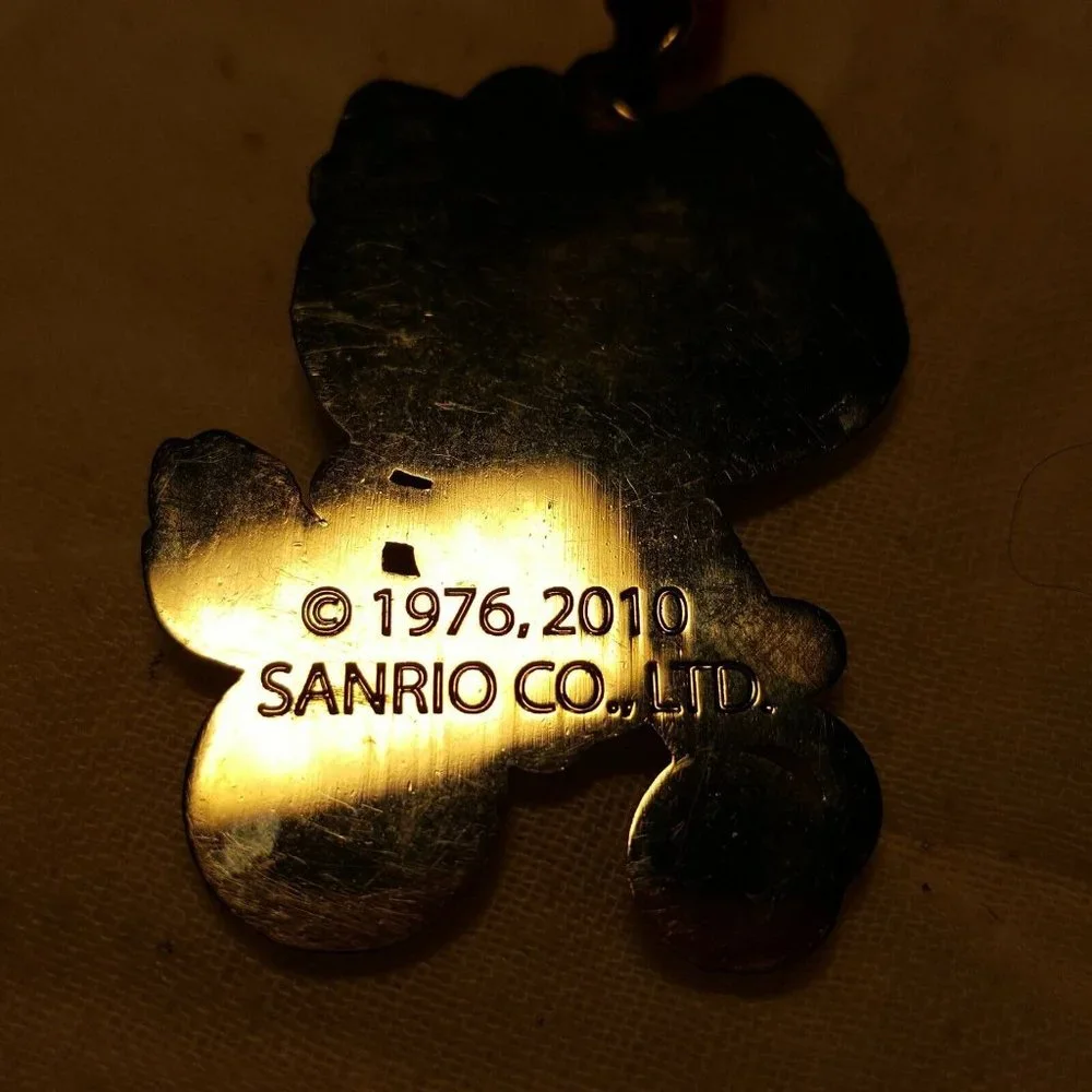2010 Sanrio Hello Kitty Old School Bike Trike Necklace on Red Cord Appx 2